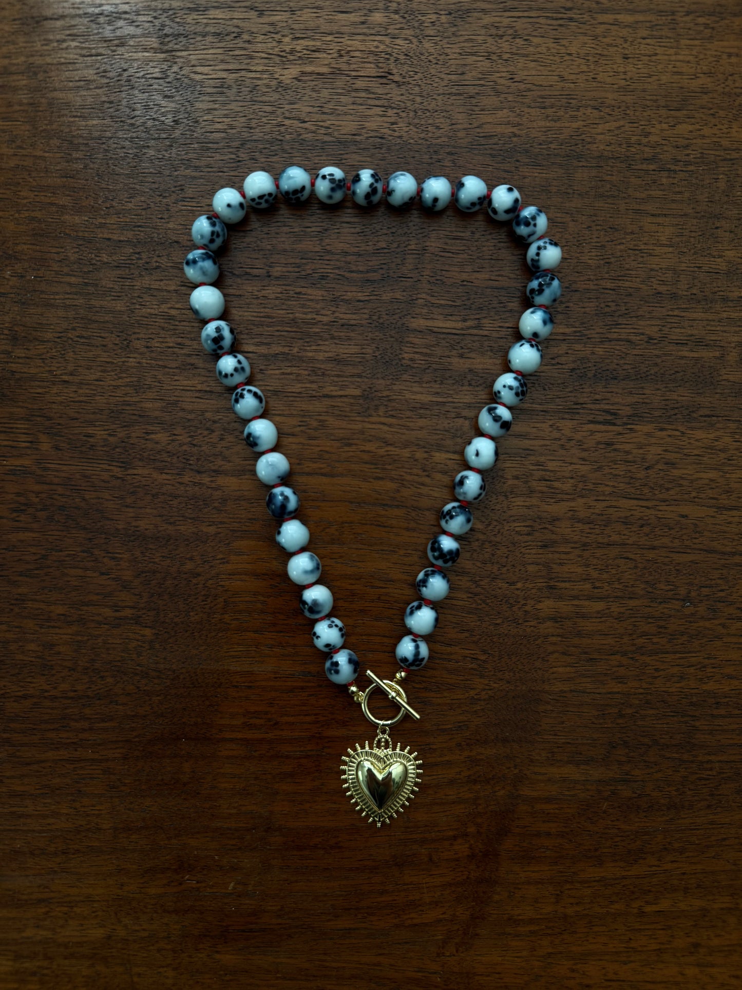 SNAKE GLASS AND RED BEADED HEART