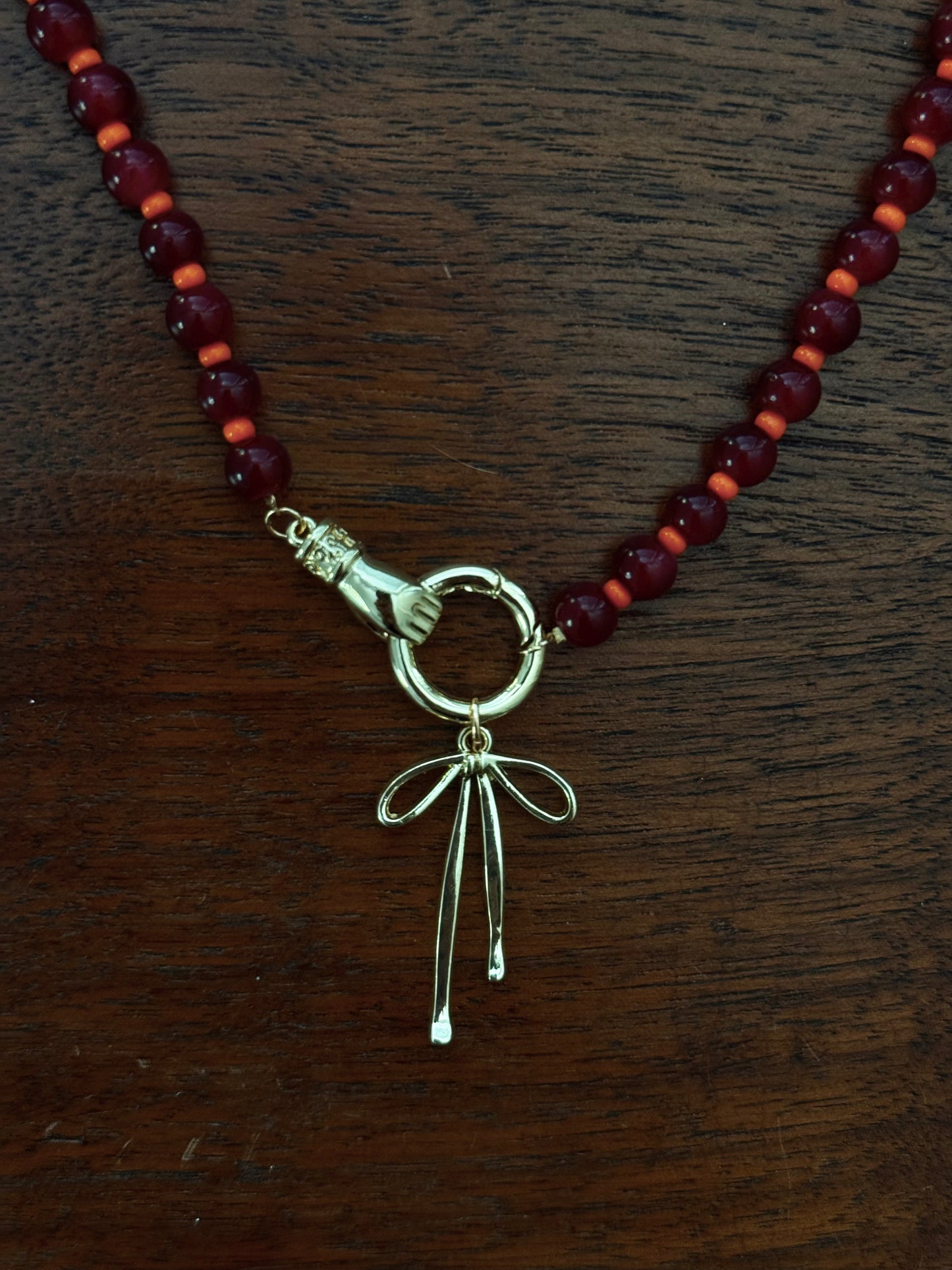 RED AND ORANGE BEADED BOW