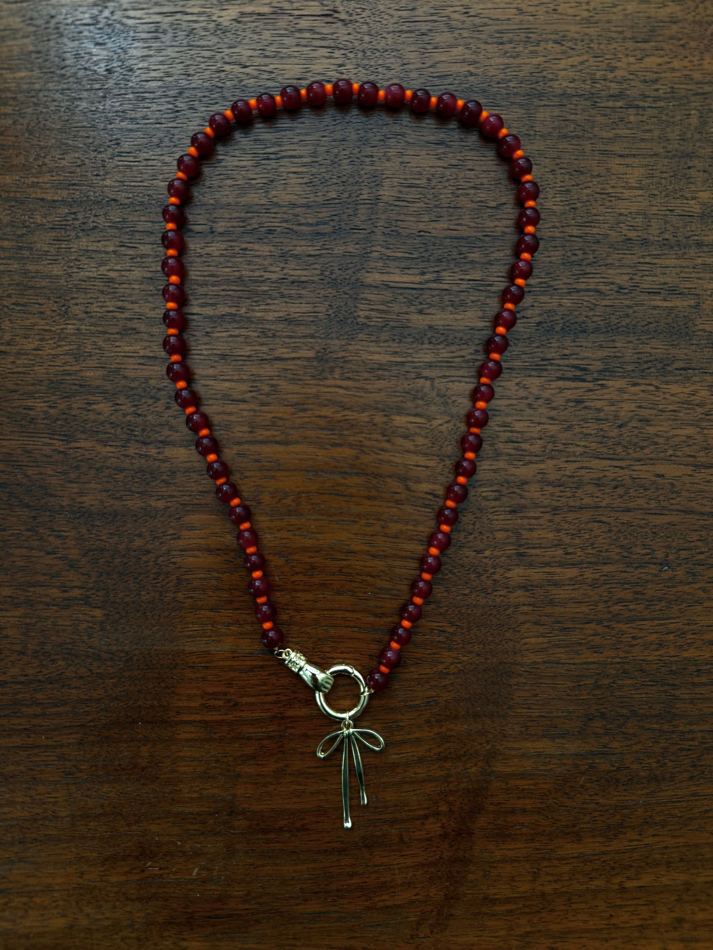 RED AND ORANGE BEADED BOW